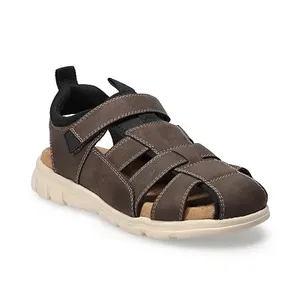 Brown fisherman sandals with multiple straps and a hook-and-loop closure, featuring a light-colored cushioned sole.