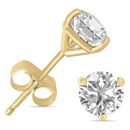 A pair of gold stud earrings featuring a round-cut diamond set in a four-prong setting.