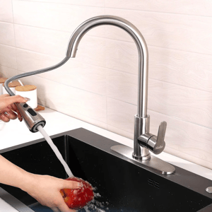 The Mueller Pull-Down Kitchen Faucet features a sleek, stainless steel design with a flexible, retractable hose for easy maneuverability. It includes a single handle for temperature control and is shown being used to rinse an apple in a black sink.
