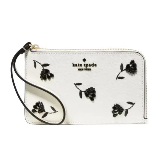 White wristlet with black floral embroidery and a zipper closure, featuring a small strap and brand logo.