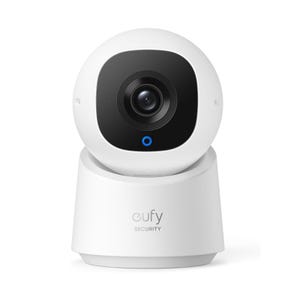The Eufy Pan & Tilt Indoor Cam is a white, round security camera with a black face, featuring a central lens and a blue indicator light. It offers movable positioning for enhanced surveillance coverage within indoor spaces.