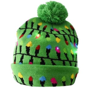 Green beanie with a Christmas light pattern and a pom-pom on top.