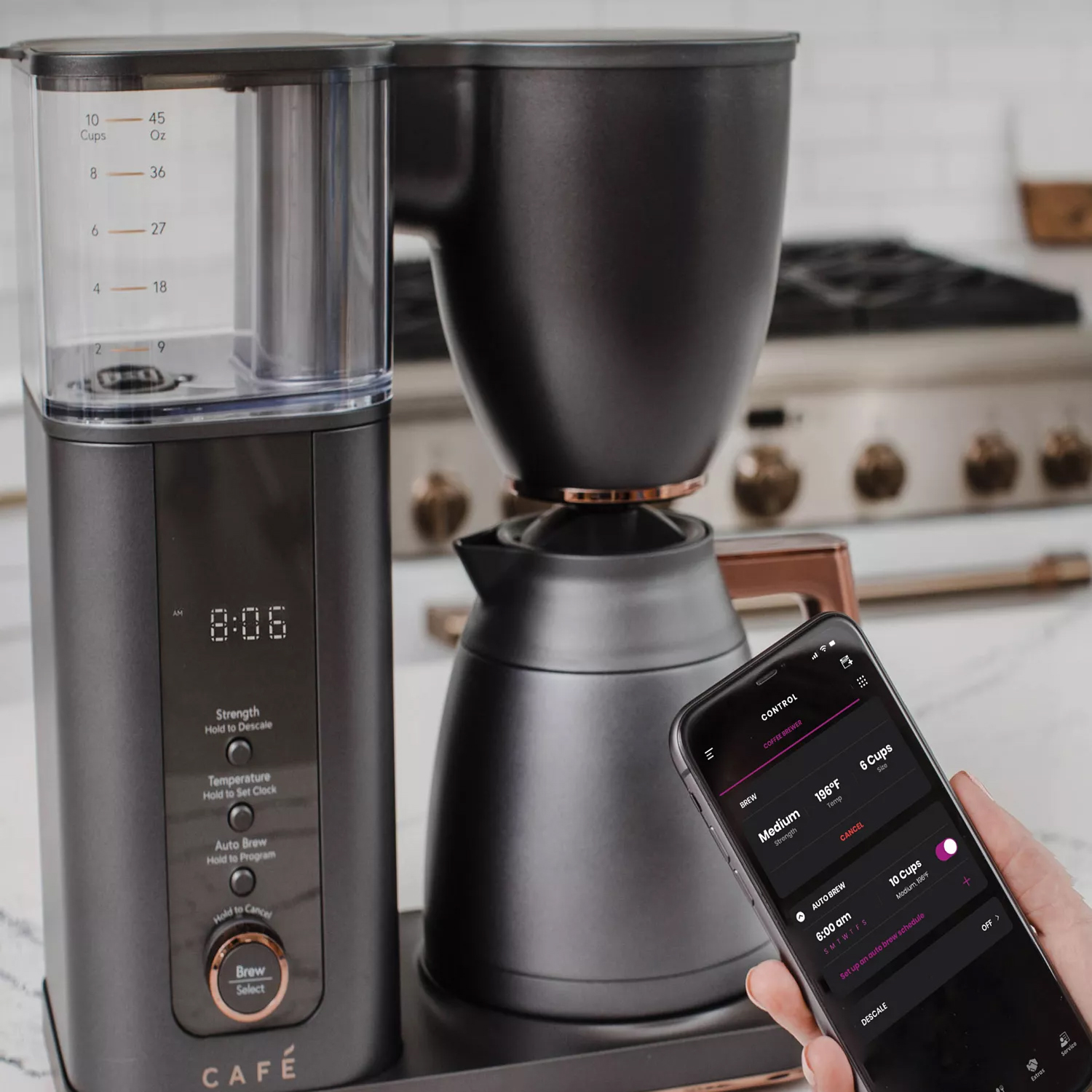 A smart coffee maker with a digital display and a smartphone app for controlling strength, temperature, and scheduling brew times.