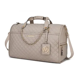 A beige quilted leather duffle bag with gold chain accents, dual handles, and an adjustable shoulder strap, featuring a decorative emblem tag and side zip pockets.