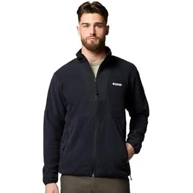 A man wearing a black Columbia fleece jacket with a full front zipper and side pockets.
