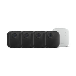 Blink Outdoor XR Camera Kit includes four black outdoor security cameras and a white sync module, designed for home surveillance.