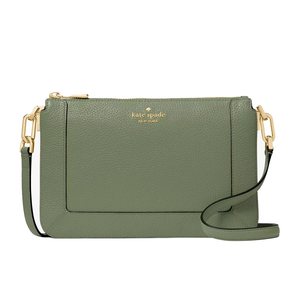 A green Kate Spade crossbody bag made of pebble leather, featuring gold hardware, a zipper closure, and an adjustable strap, with the brand logo embossed on the front.