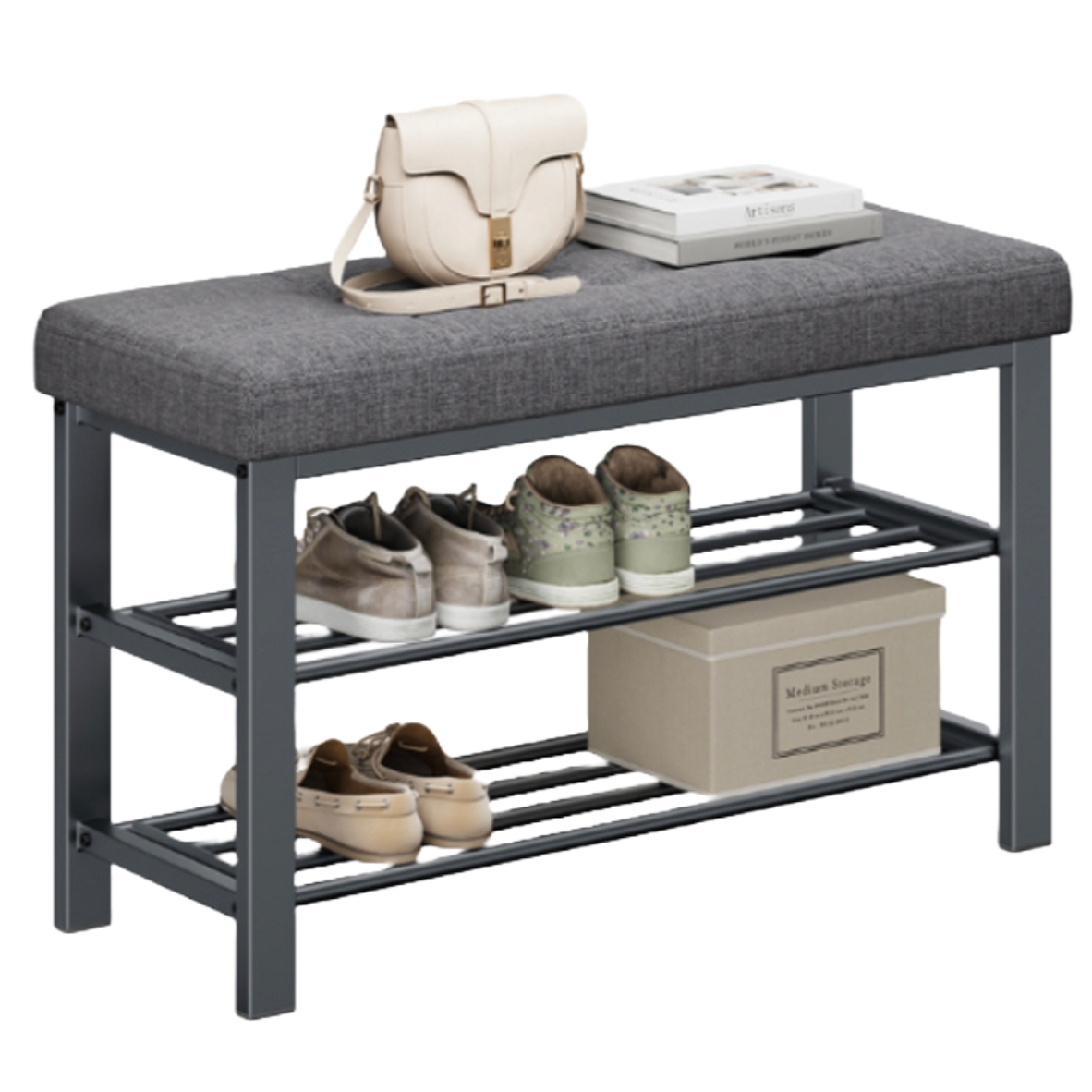 A gray cushioned bench with a metal frame, featuring two slatted shelves for shoe storage, topped with a cream handbag and a stack of books. Beneath, there are three pairs of shoes and a labeled storage box.