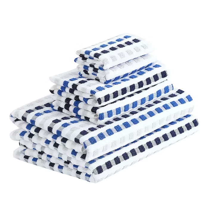 A stack of towels with a checkered pattern in blue, black, and white colors, arranged in a descending size order.