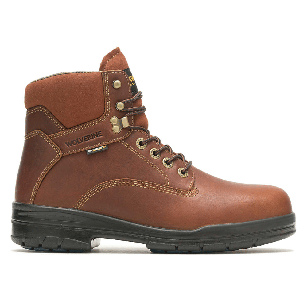 Brown leather work boot with black sole, featuring the Wolverine logo, metal eyelets, and reinforced stitching.