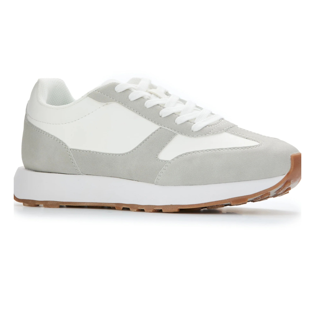 A casual sneaker with a white and light gray color scheme, featuring suede accents, a white midsole, and a gum outsole.