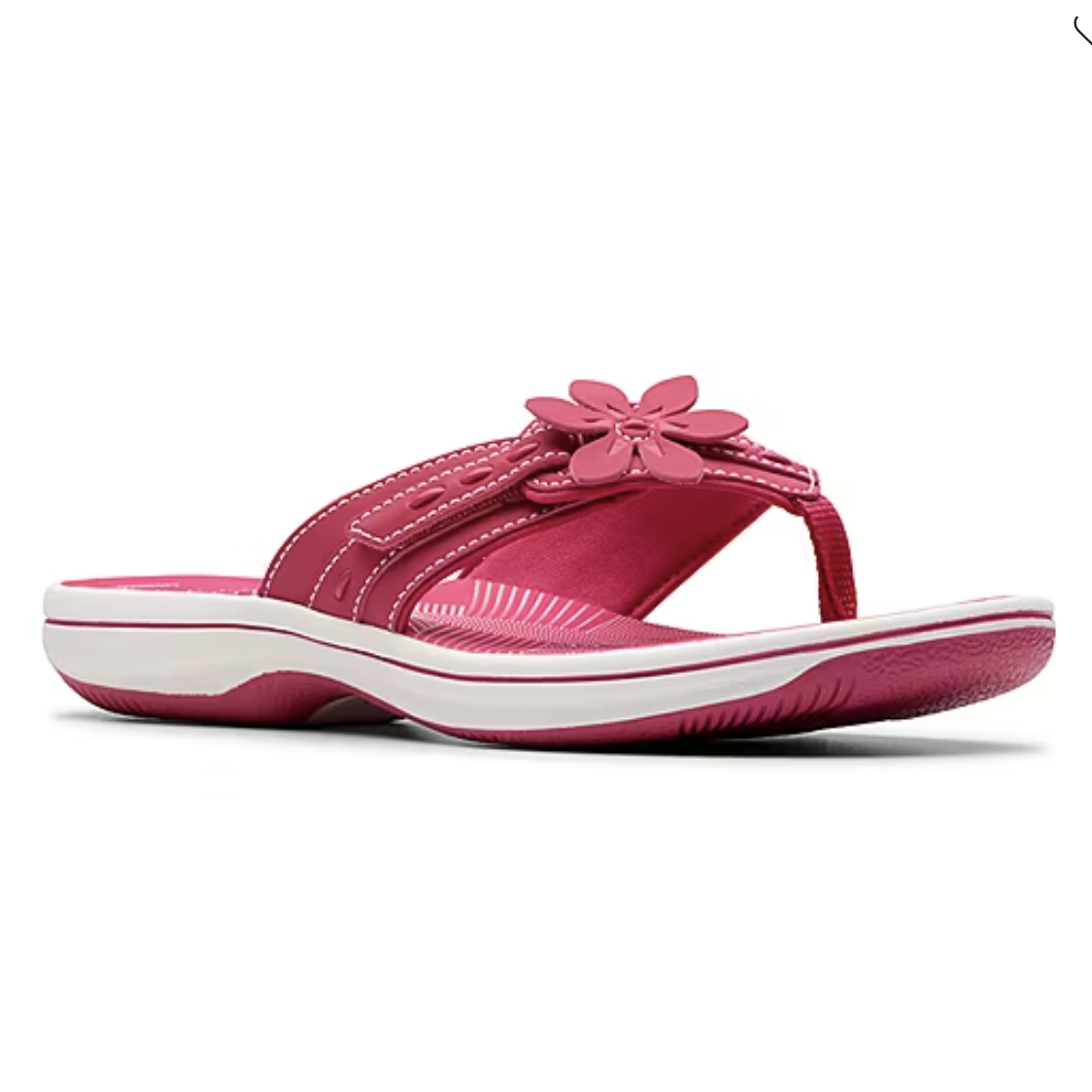 A pink sandal with white stitching and a flower decoration on the strap, featuring a white sole with pink accents.