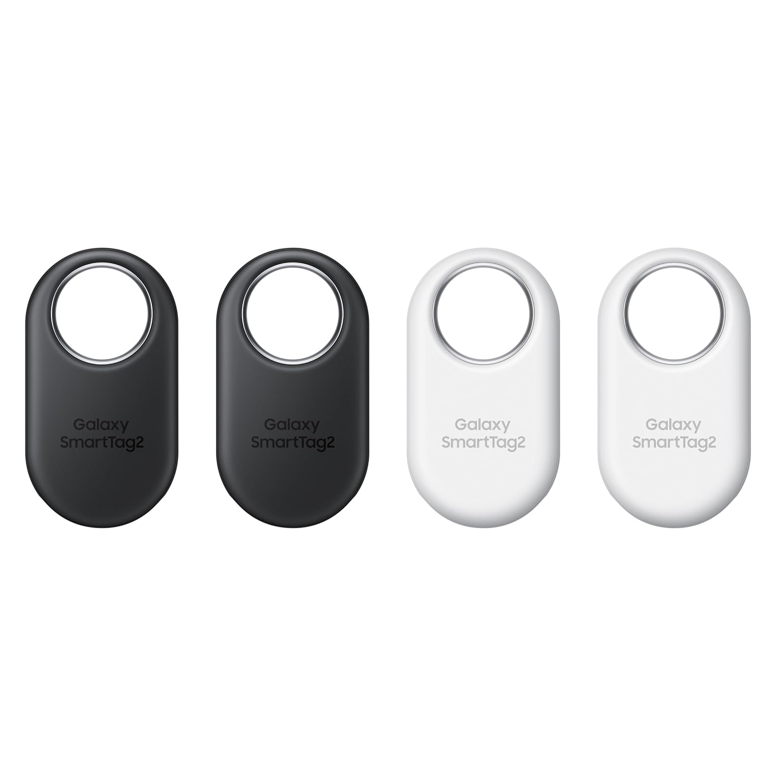 Four Samsung Galaxy SmartTag+ devices are displayed, two in black and two in white, each with a centered circular cutout for attaching to objects.