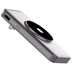 A sleek, portable power bank with a USB port and a black circular wireless charging pad on its surface, featuring LED indicators for power level and a built-in plug for charging.