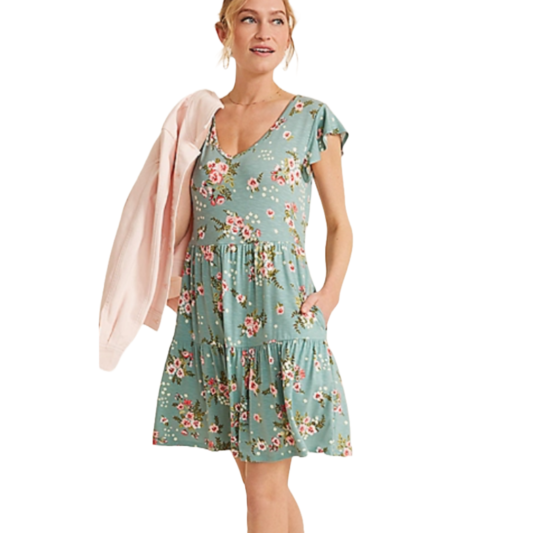 A light blue floral babydoll dress with flutter sleeves, a deep V-neckline, and a tiered skirt. The dress features a casual fit and short hem, paired with a light pink cardigan draped over one shoulder.