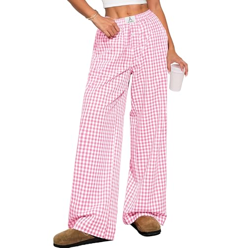 Pink and white checkered wide-leg pants paired with brown slippers; the model holds a cup.