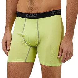 A man is wearing light green boxer briefs with a black waistband displaying the brand \“32° Cool\“.