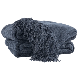 A folded dark blue throw blanket with fringe detailing on one edge.