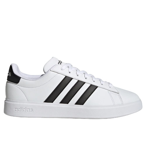 A white Adidas sneaker featuring black stripes and a low-top design with a lace-up closure. The branding is visible on the heel and tongue.