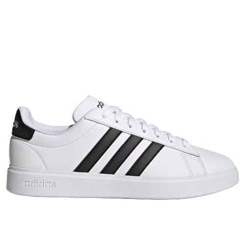 A white Adidas sneaker featuring black stripes and a low-top design with a lace-up closure. The branding is visible on the heel and tongue.