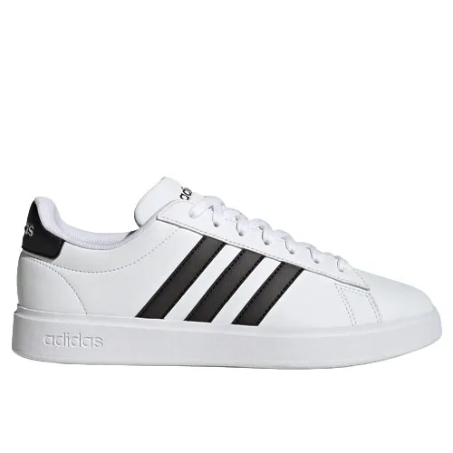 A white Adidas sneaker featuring black stripes and a low-top design with a lace-up closure. The branding is visible on the heel and tongue.