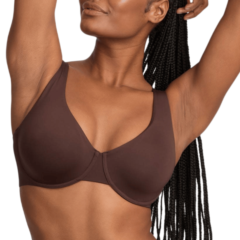 Woman wearing a brown underwire bra and matching bottoms, with her arm raised and braided hairstyle visible.