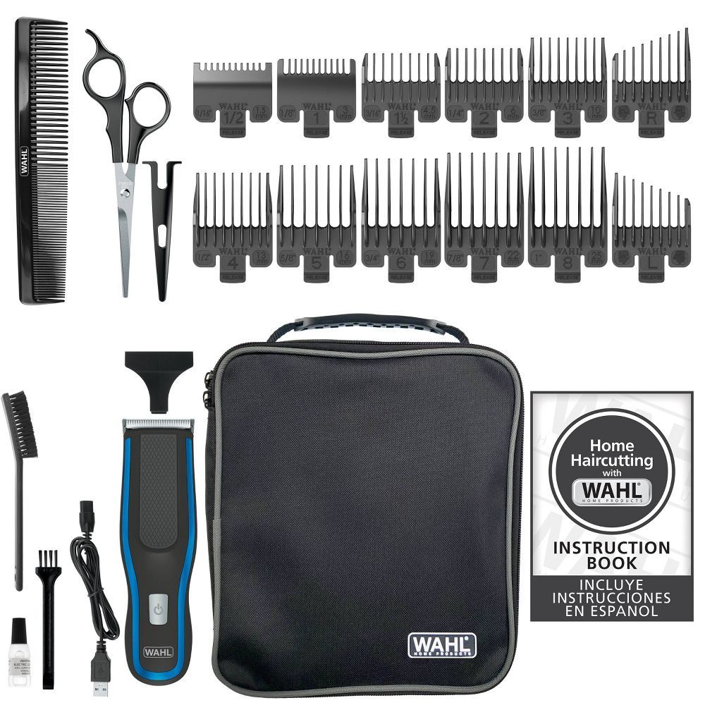 Wahl hair cutting kit with clippers, multiple guide combs, scissors, comb, cleaning brush, oil, USB charging cable, storage case, and instruction book with Spanish guide.