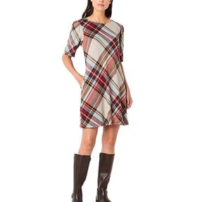 A short-sleeve shift dress with a diagonal multicolored plaid pattern, featuring a round neckline and knee-length hem. Paired with knee-high black boots.