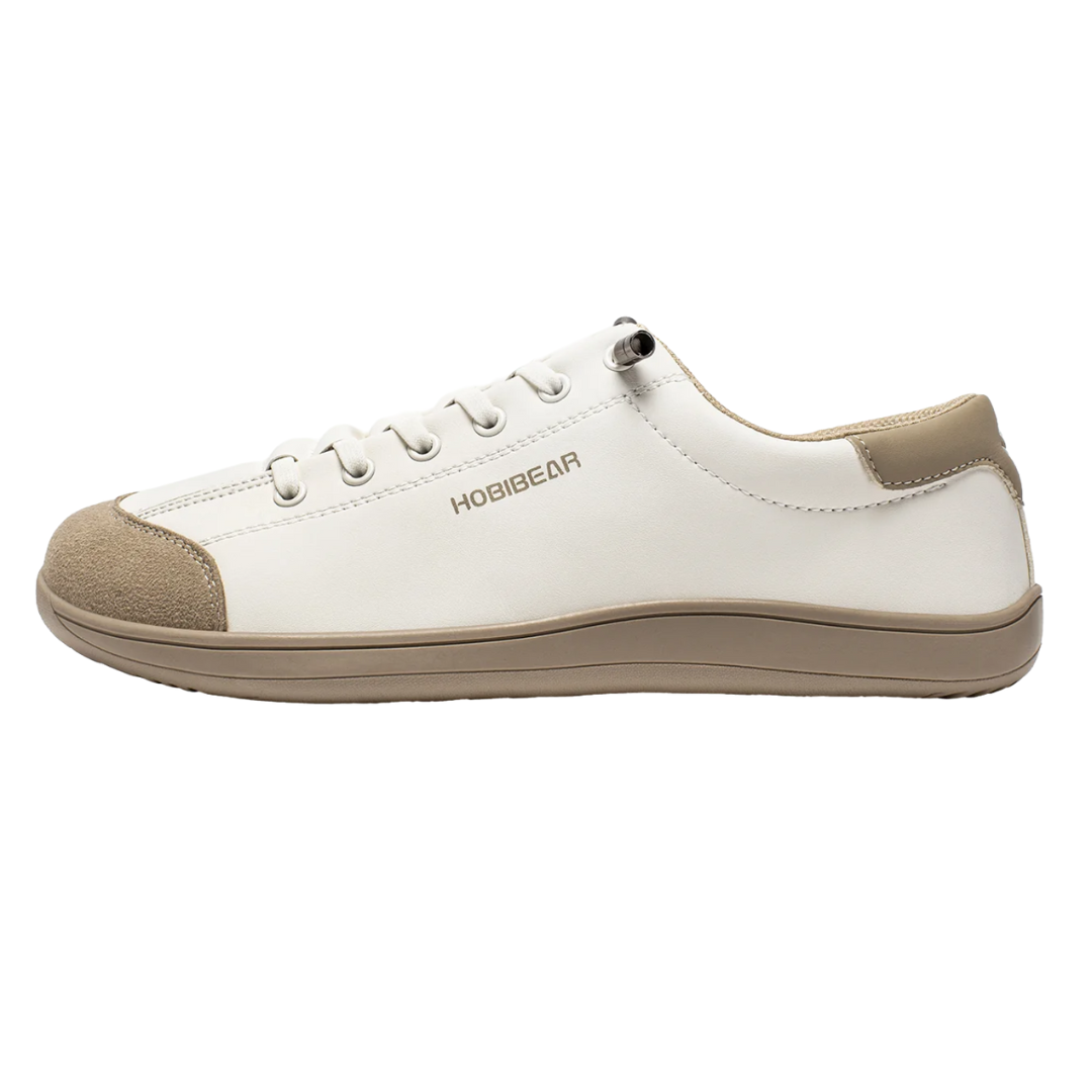 Hobibear casual white sneaker featuring a lace-up design, beige rubber sole, and suede accents on the toe and heel.
