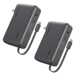 A pair of black power banks with 10,000 mAh capacity, featuring a digital display, USB-C port, and foldable plug for wall charging.