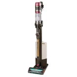 Cordless vacuum cleaner with a sleek, upright design and a self-standing charging base.