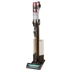 Cordless vacuum cleaner with a sleek, upright design and a self-standing charging base.