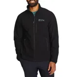 A man wearing a black Eddie Bauer jacket with a front zipper, two side pockets, and a chest logo, paired with dark trousers.