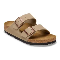 A beige sandal with two adjustable straps and copper buckles, featuring a cork footbed on a black outsole.