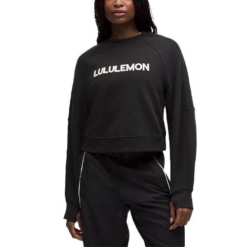 A black Lululemon sweatshirt featuring a white logo on the chest, paired with matching black pants.