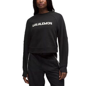 A black Lululemon sweatshirt featuring a white logo on the chest, paired with matching black pants.