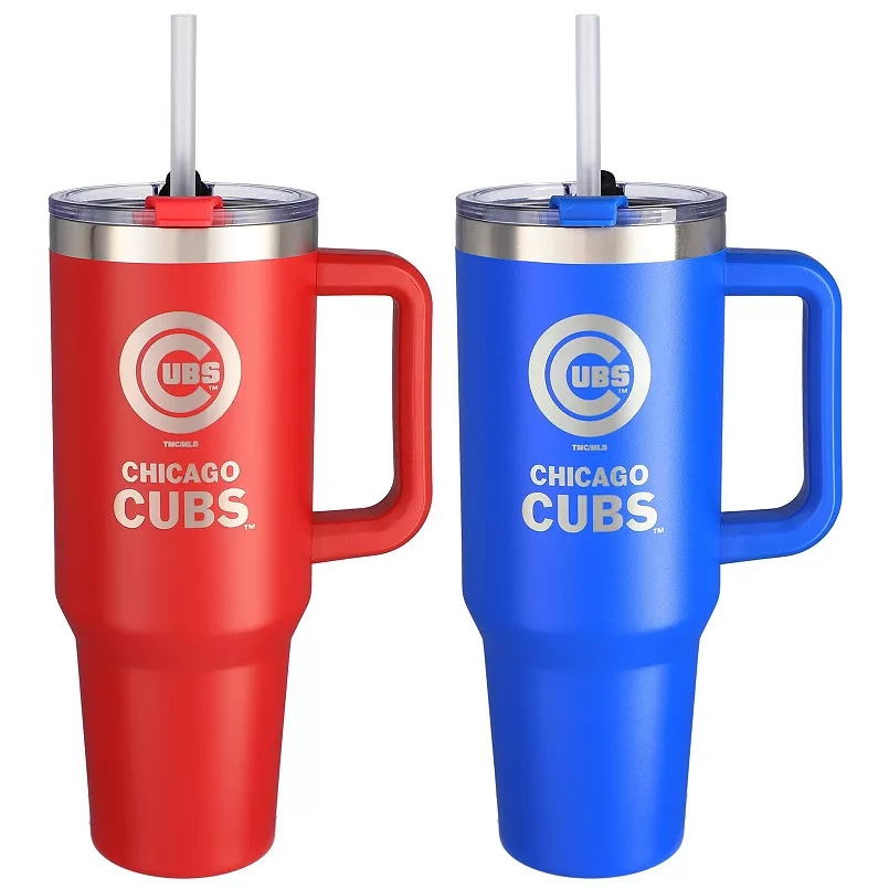 The Chicago Cubs 46oz Home/Away Tumbler Set includes two large mugs, one red and one blue, each featuring the team's logo and a handle. They come with clear lids and reusable straws.
