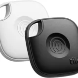 Two Tile Mate Bluetooth trackers, one black and one white, designed for finding lost items using a connected mobile app.