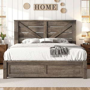 A rustic wooden bed frame with a geometric headboard design, adorned with white bedding and a textured throw blanket. Flanked by two wooden nightstands, the area features decorative wall accents, including a \“HOME\“ sign.