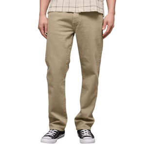 A person is wearing beige jeans with a plaid shirt and black sneakers featuring white soles.