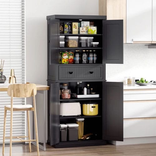 A freestanding kitchen pantry cabinet with various storage compartments, including shelves and drawers, is shown, filled with food items and kitchenware.