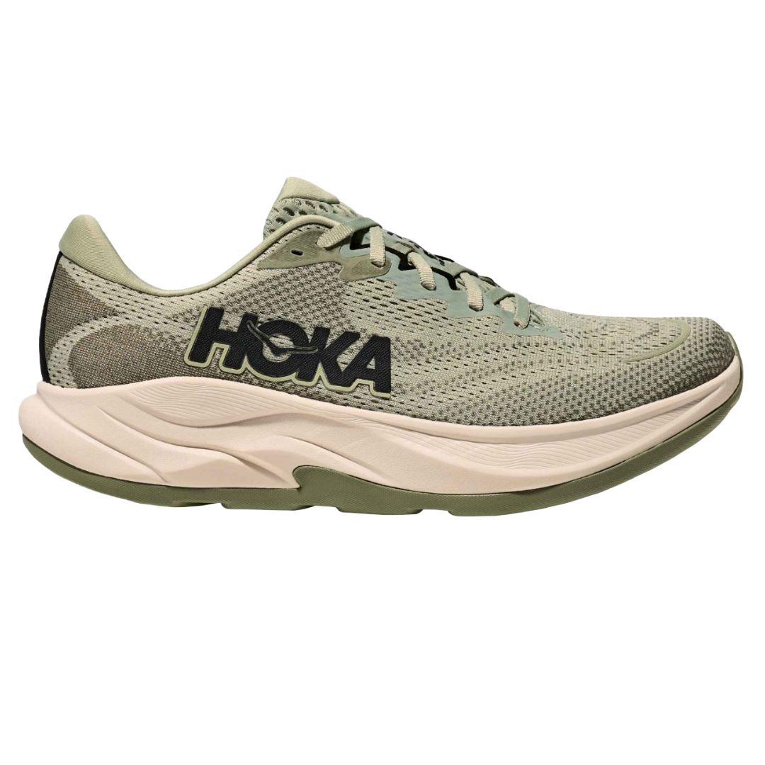 Hoka running shoe with a light green and beige color scheme, featuring a mesh upper and cushioned midsole.