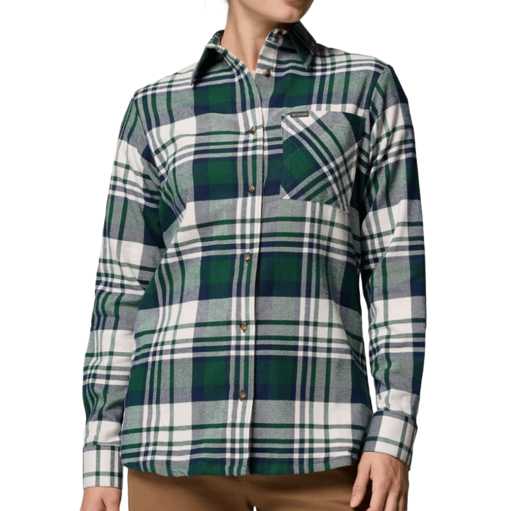 A green and white plaid flannel shirt with a chest pocket and brown buttons, paired with brown pants.