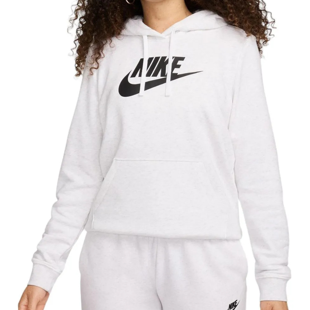 A person is wearing a white Nike hoodie and matching sweatpants, both featuring the brand's logo.