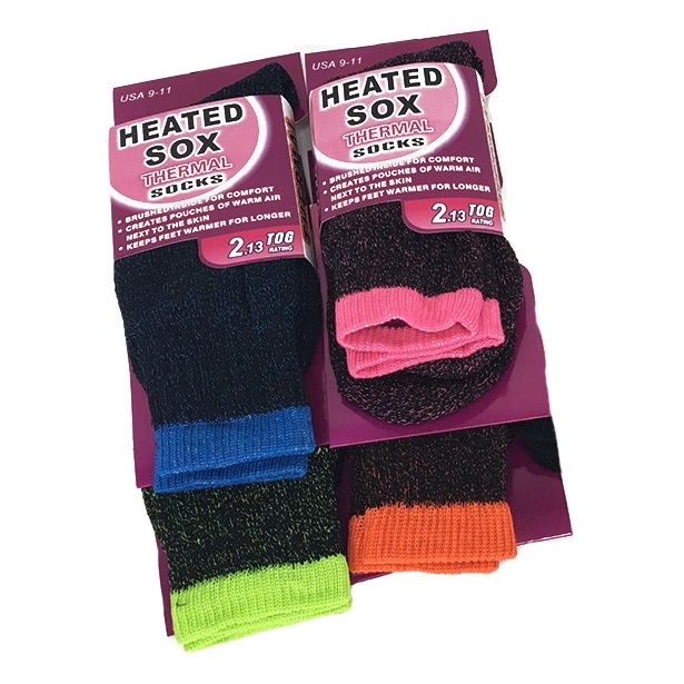 Two pairs of Heated Sox thermal insulated socks are displayed, one in black with blue and green accents and the other in black with pink and orange accents, both designed to keep feet warm.