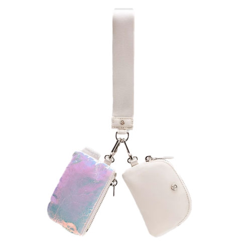 A dual pouch wristlet features an iridescent pouch and a white pouch connected by a detachable white strap, each with a zipper closure and metal clasps.