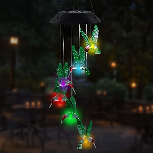 A solar-powered LED wind chime featuring multiple colorful hummingbird figures that light up, suspended from a black canopy.