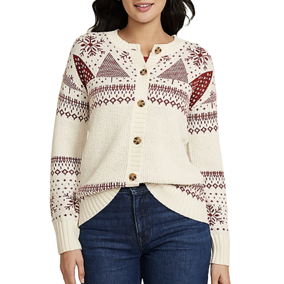 A cream cardigan with red geometric and snowflake patterns, featuring wooden buttons, paired with dark blue jeans.
