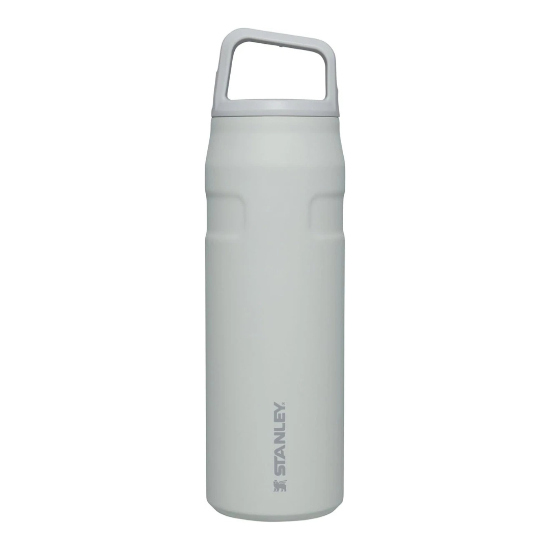 A white Stanley insulated water bottle with a handle on the lid, designed for keeping beverages hot or cold.