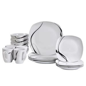A 16-piece dinnerware set featuring a modern black and white swirl design, including plates, bowls, and mugs.